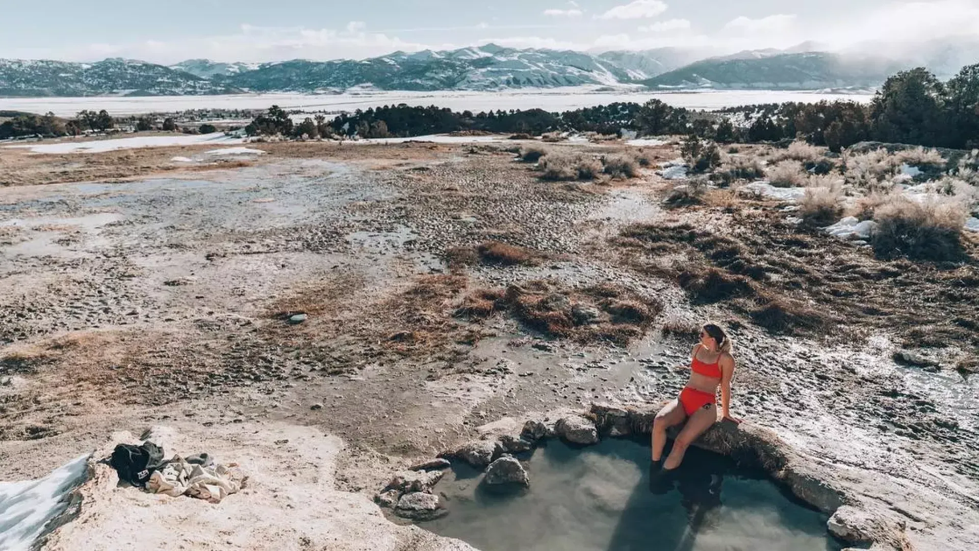 A woman relaxes in a natural hot springs beyond San Francisco.